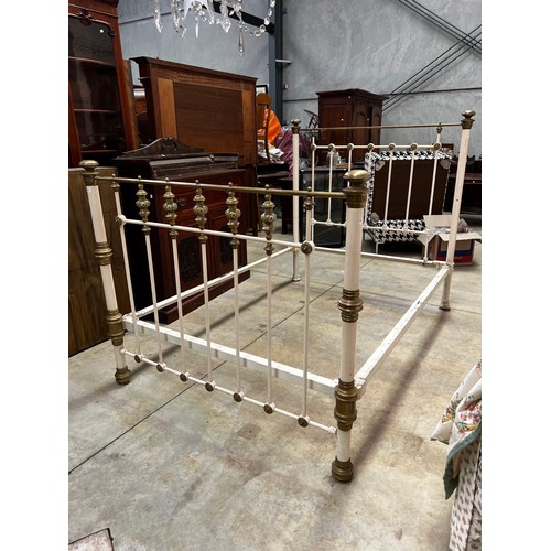 670 - Antique brass and iron double bed with spring base, including valance and quilt, approx 146cm H x 21... 