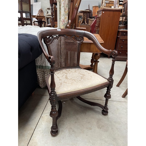 697 - Vintage caned armed chair
