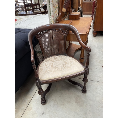 697 - Vintage caned armed chair