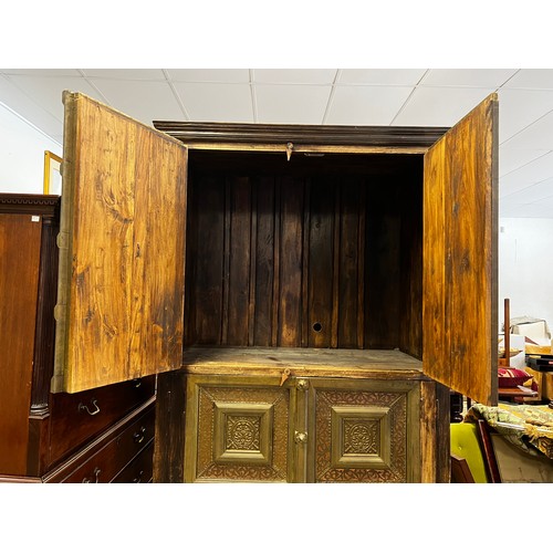 736 - Large Indian four door cabinet, with applied stepped brass framed panels and applied bosses, approx ... 