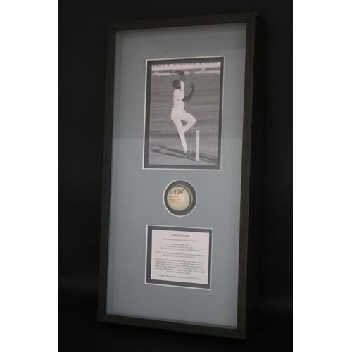 1404 - Signed Cricket ball framed, Courtenay Walsh. Approx 74cm x 46cm. Provenance: Ken Rosewall Collection