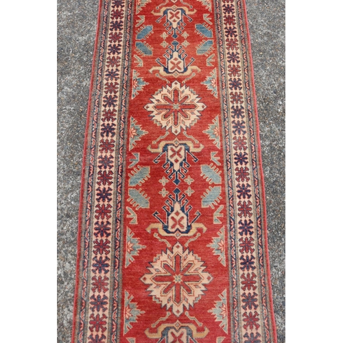 51 - Persian wool hall runner, central red ground field, approx 74cm X 250cm Ex Cadry's Sydney