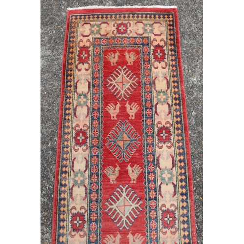 52 - Persian wool hall runner, central red ground field, approx 74cm X 250cm Ex Cadry's Sydney