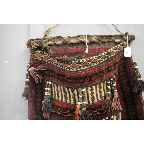 62 - Tribal wool camel bag, with applied tassels, approx 67cm x 58cm