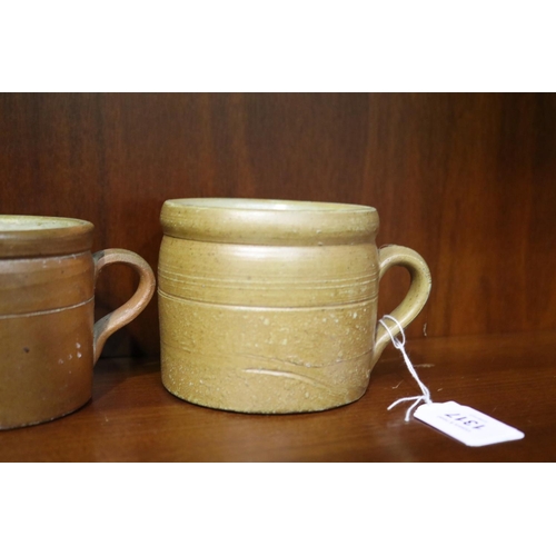 134 - Two antique French stoneware pots, approx 8.5cm H and smaller (2)