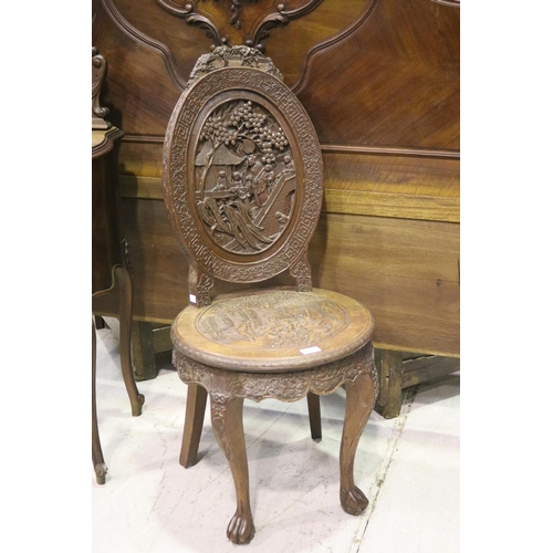 140 - Finely carved oak & teak Chinese salon chair. The front of the oval cameo back deeply carved with a ... 