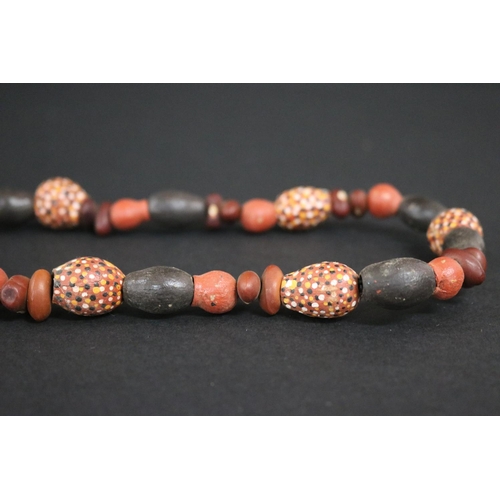 55 - Lisa Pultara (c1959-.) Australia (Aboriginal deceased) Painted beads, bean tree & gumnut, 1987, Anma... 