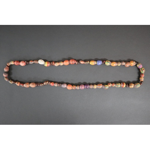 56 - Lisa Pultara (c1959-.) Australia (Aboriginal deceased) Painted beads, bean tree & gumnut, 87, Anmatj... 