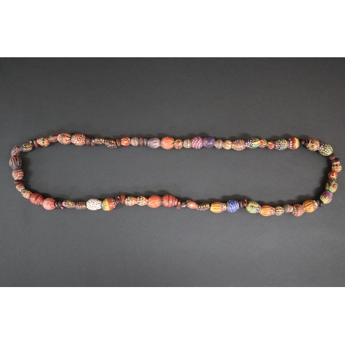 56 - Lisa Pultara (c1959-.) Australia (Aboriginal deceased) Painted beads, bean tree & gumnut, 87, Anmatj... 