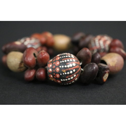 57 - Lisa Pultara (c1959-.) Australia (Aboriginal deceased) Painted bracelet, bean tree & gumnut, 87, Anm... 