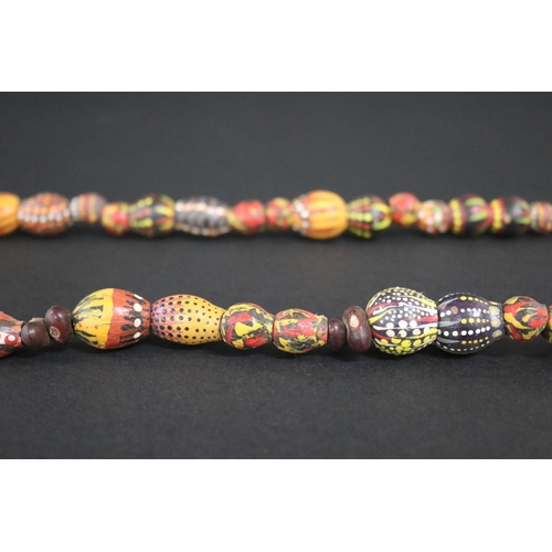54 - Lisa Pultara (c1959-.) Australia (Aboriginal) (deceased) painted beads, bean tree & gumnut, 1987, An... 