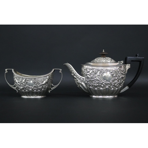 75 - Victorian sterling silver teapot and matching double-handled sugar bowl with ornate repousse design ... 