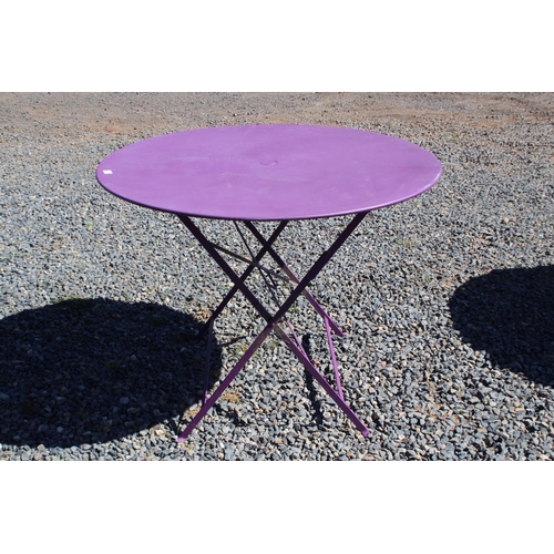 112 - Purple painted French style circular metal folding base garden table, approx 73cm H x 97cm dia