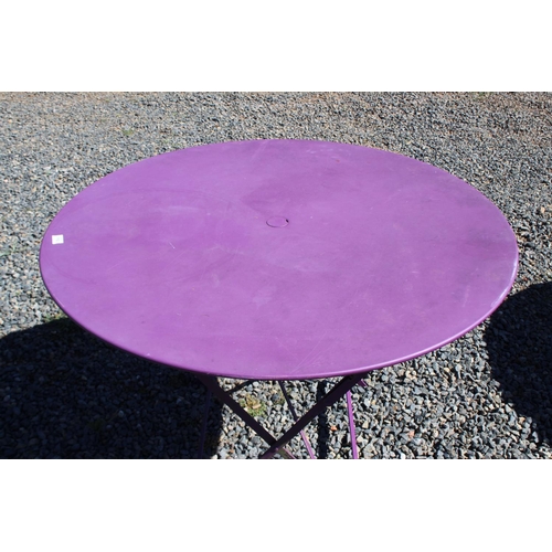 112 - Purple painted French style circular metal folding base garden table, approx 73cm H x 97cm dia