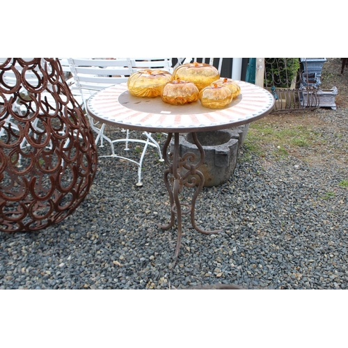 125 - Tiled top circular garden table with wrought iron base, approx 79cm H x 80cm Dia