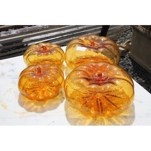 128 - Five amber glass pumpkins, approx 21cm Dia and smaller (5)  please note an extra one has been added ... 