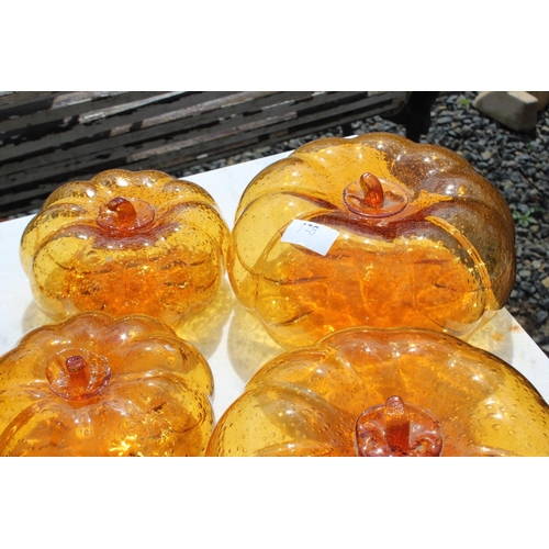 128 - Five amber glass pumpkins, approx 21cm Dia and smaller (5)  please note an extra one has been added ... 