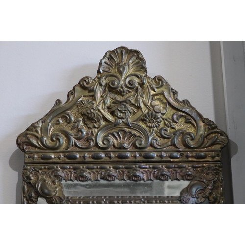 565 - Antique French repousse brass cushion mirror, approx 60 cm x 33 cm