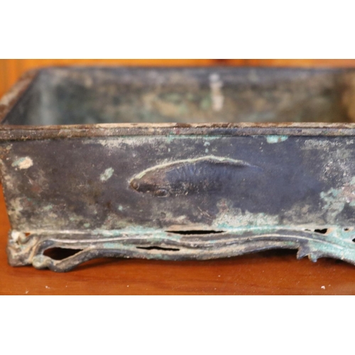 505 - Antique early Chinese bronze censer, of rectangular shape, applied loop handles, cast in relief to t... 