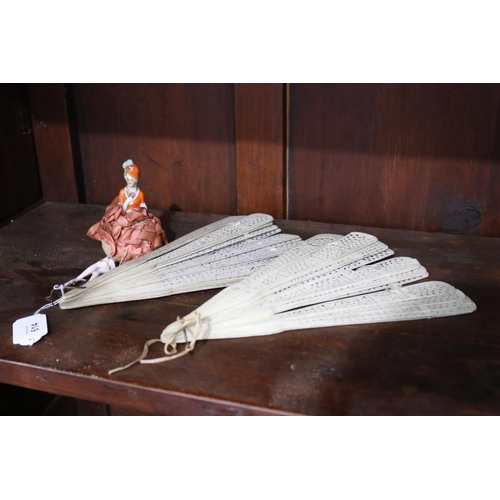 614 - Two antique bone fans along with a pin cushion half doll with legs, approx 26cm L and smaller (3)