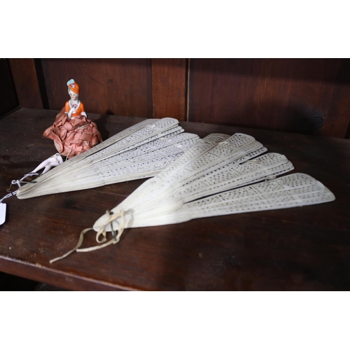 614 - Two antique bone fans along with a pin cushion half doll with legs, approx 26cm L and smaller (3)