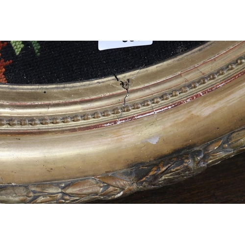 385 - Antique 19th century French oval giltwood and gesso frame, with later wool work panel, frame approx ... 