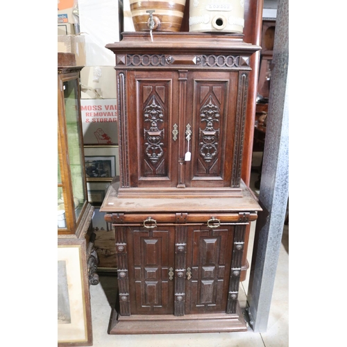 462 - A late 19th century Continental walnut side cabinet, fitted with four carved and panelled doors, the... 