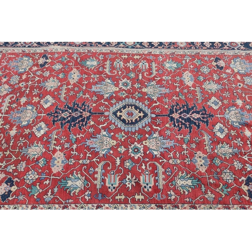 86 - Large handwoven carpet of red ground, approx 420 L x 300 W