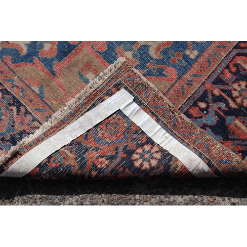 87 - Semi antique village weave hand knotted wool carpet, with central blue medallion. Approx 340 L x 258... 