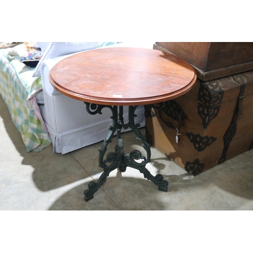 521 - English cast iron based circular wooden topped table, approx 74cm H x 75cm Dia