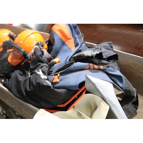 304 - Two as new Stihl helmets and ear protective wear, along with protective pants and chaps