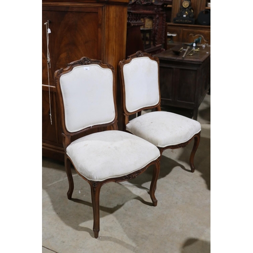 599 - Pair of antique French carved walnut side chairs in the Louis XV style (2)