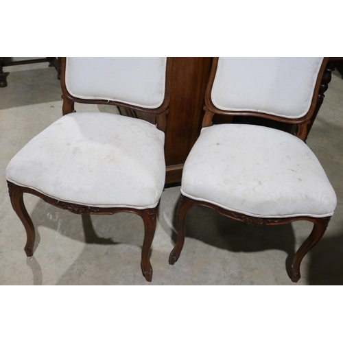 599 - Pair of antique French carved walnut side chairs in the Louis XV style (2)