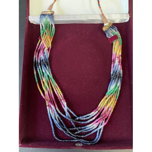 152 - Contemporary Eastern necklace, 9 strands of semi precious multi stones that make an IKAT design, on ... 