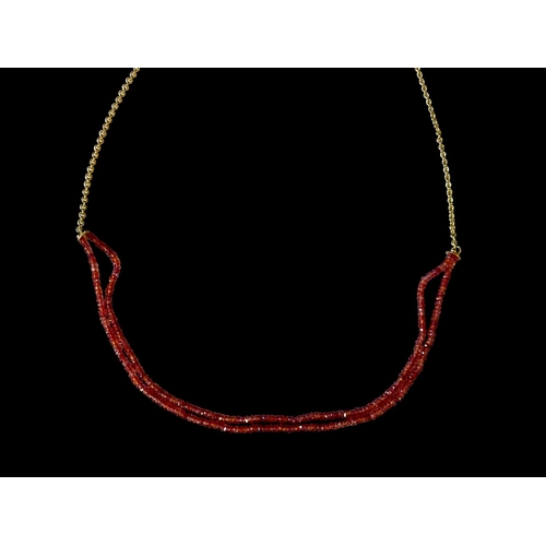 161 - 14ct yellow gold long chain with faceted red stones (possibly ruby extension) . Purchased in Vienna ... 