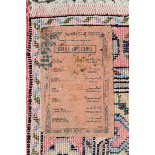 219 - Moroccan hand knotted wool carpet, approx 222cm x 306cm.