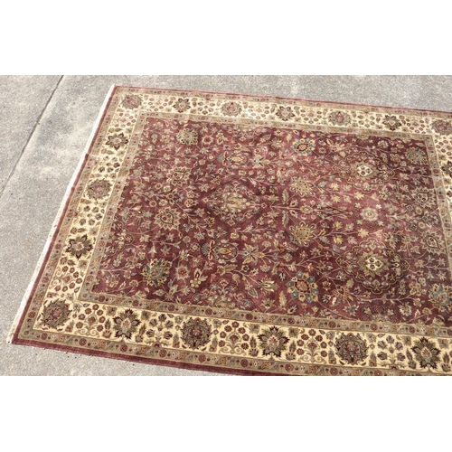 223 - Large good quality Indian wool carpet of autumn tone, approx  272cm x 363cm