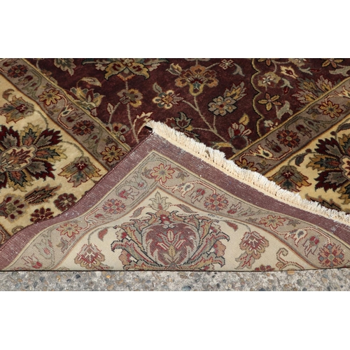 223 - Large good quality Indian wool carpet of autumn tone, approx  272cm x 363cm