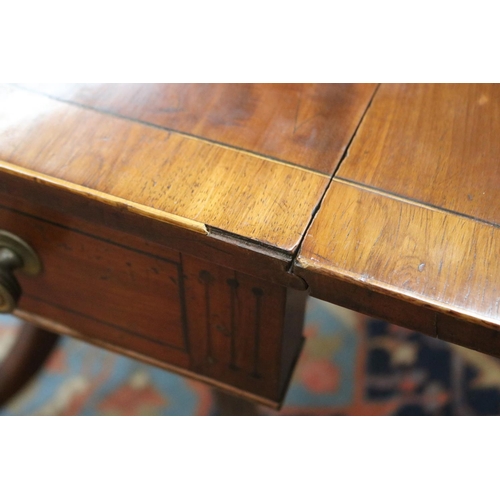 139 - Antique late George III mahogany sofa table, the twin flap rectangular top with canted corners cross... 