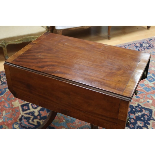 139 - Antique late George III mahogany sofa table, the twin flap rectangular top with canted corners cross... 