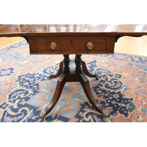139 - Antique late George III mahogany sofa table, the twin flap rectangular top with canted corners cross... 