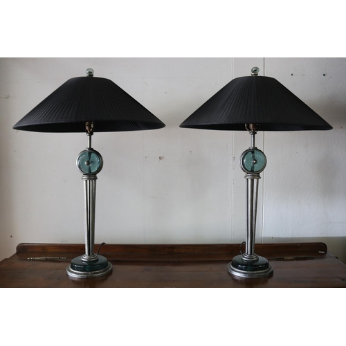 24 - Pair of modern green glass and iron lamps, with black pleated shades, in working condition at time o... 