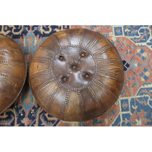 26 - Pair of large leather ottomans, stitched sectional button shape, each approx 32cm H x 83cm Dia (2)