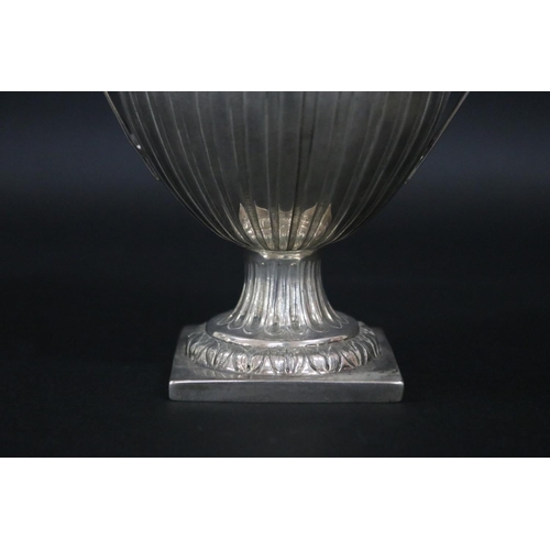 121 - Sterling silver pedestal twin handled cup, approx 15cm H x 17cm W and approx 315 grams excluding gla... 