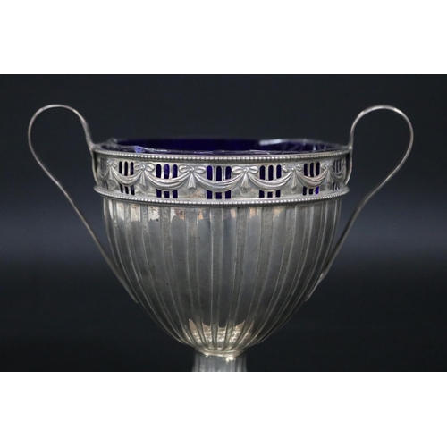 121 - Sterling silver pedestal twin handled cup, approx 15cm H x 17cm W and approx 315 grams excluding gla... 