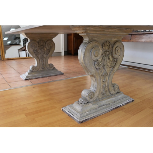 176 - Impressive rectangular topped stone table, twin pedestal wooden supports, approx 76cm H x 220cm W x ... 