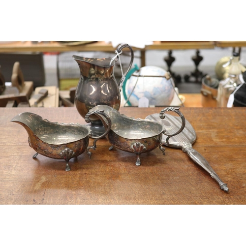 522 - Pair of silver plate sauce boats, a water pitcher and hand mirror, heavily damaged, approx 35cm L an... 