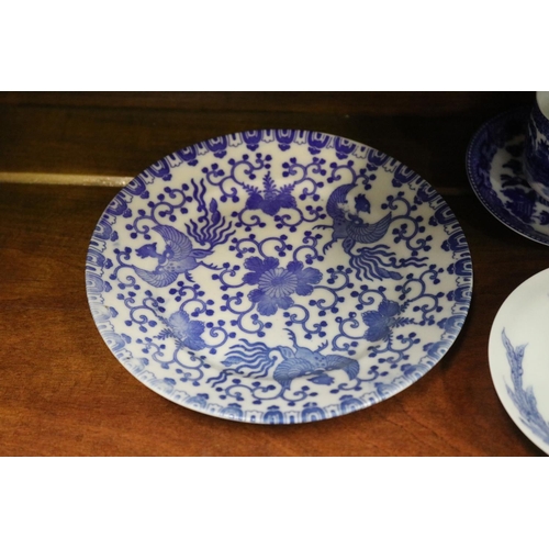 535 - Assortment of blue and white porcelain to include two Japanese cups and saucers with Geisha hologram... 