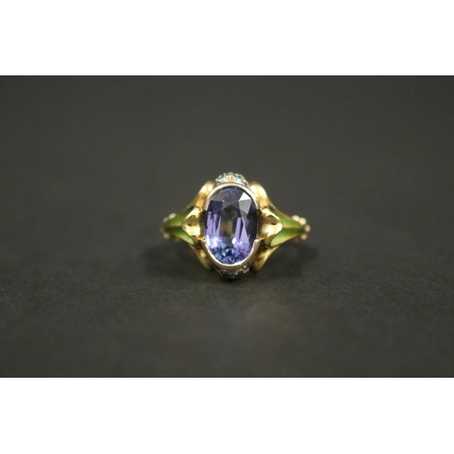 164 - 18ct gold antique style enamelled dress ring set with an oval cut tanzanite approx 2 carats, in orig... 