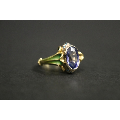 164 - 18ct gold antique style enamelled dress ring set with an oval cut tanzanite approx 2 carats, in orig... 